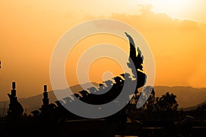 silhouette of Naka head in buddhist, decorated car in procession of Ã¢â¬ÅBoon Bang FaiÃ¢â¬Â festival or traditional Rocket